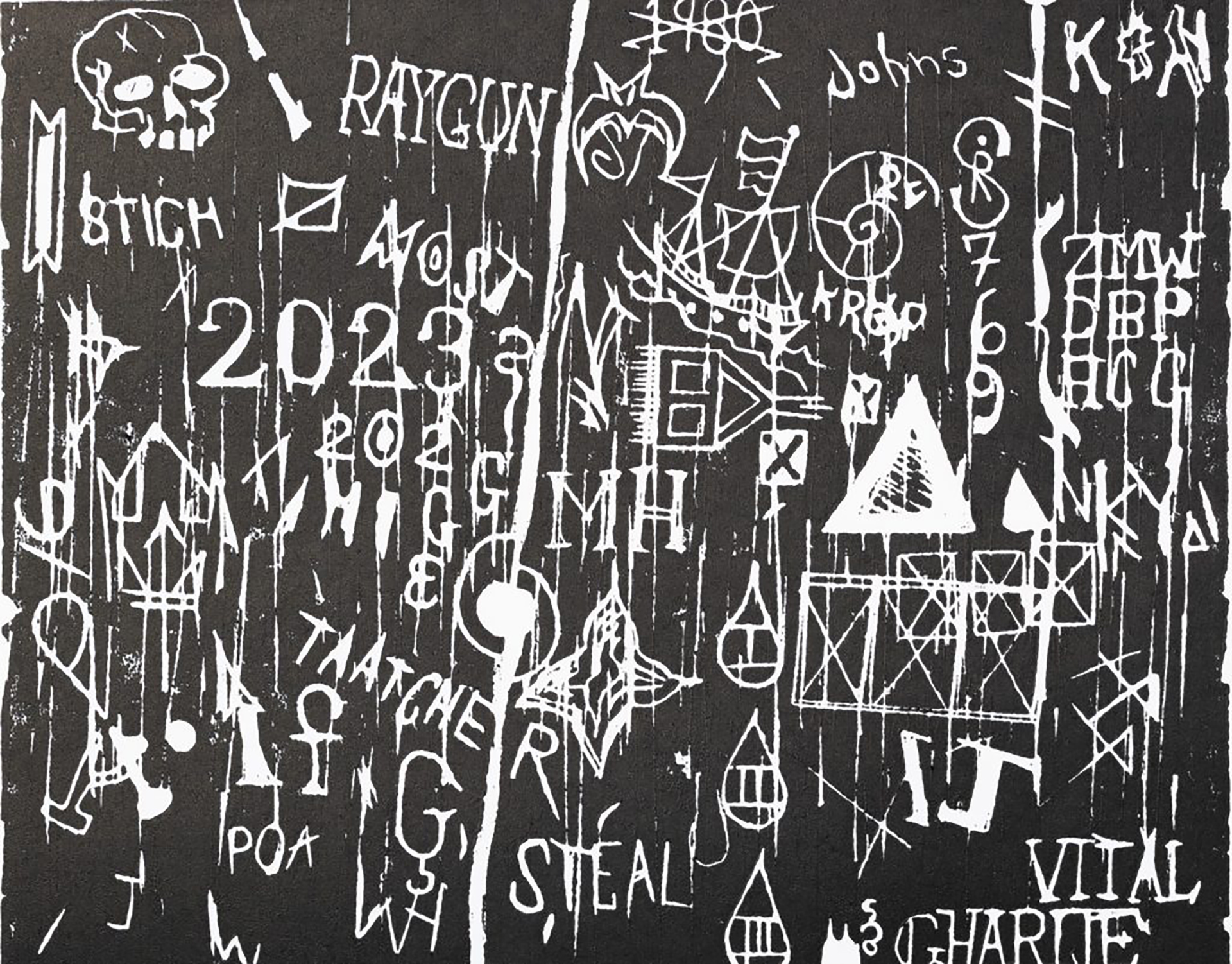 White text, numbers and symbols engraved into a black background.